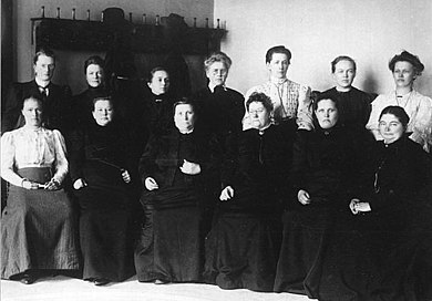 Black and white photo of 13 of the 19 female members of the Finnish parliament — the first female members of a national parliament in the world – elected in 1907. Credit: Ministry for Foreign Affairs of Finland.